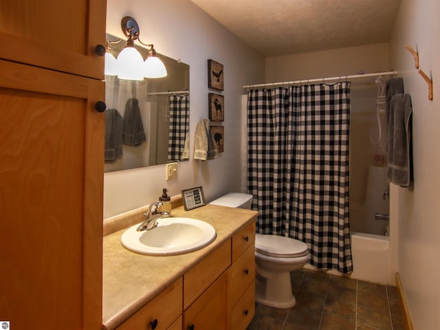full bath with tile patterned floors, a textured ceiling, toilet, shower / bathtub combination with curtain, and vanity