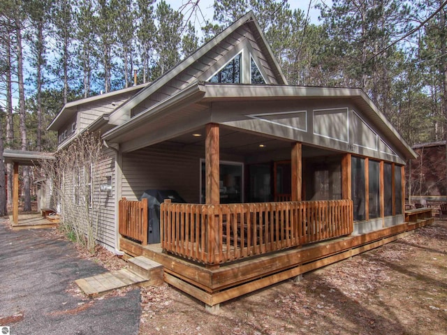 back of house with a sunroom