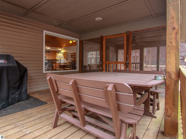 wooden terrace with grilling area and a sunroom