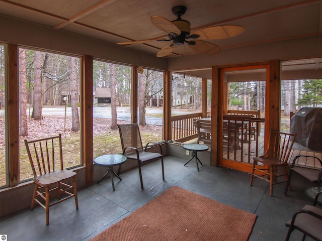 sunroom featuring plenty of natural light and ceiling fan