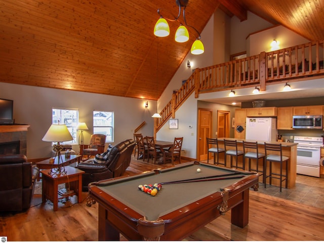 recreation room featuring wood ceiling, high vaulted ceiling, light wood-style floors, and billiards