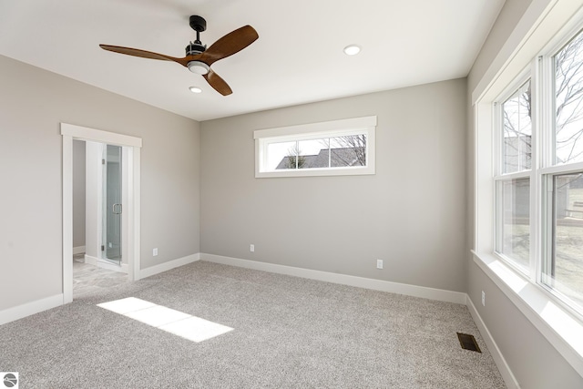 unfurnished bedroom with light carpet, baseboards, visible vents, and recessed lighting