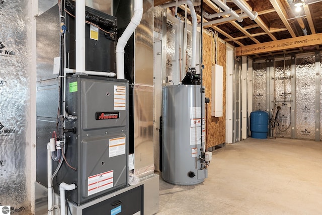 utility room with heating unit and gas water heater