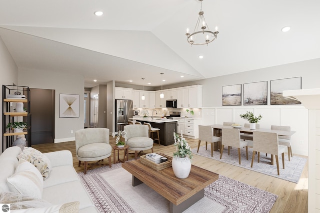 living room featuring high vaulted ceiling, recessed lighting, a chandelier, and light wood-type flooring