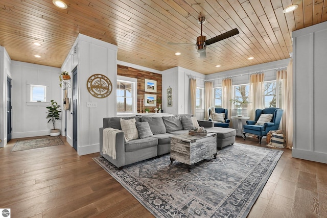 living room featuring wooden ceiling, recessed lighting, and a healthy amount of sunlight