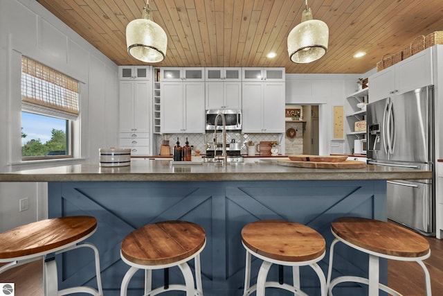 kitchen with stainless steel appliances, open shelves, wood ceiling, glass insert cabinets, and white cabinetry