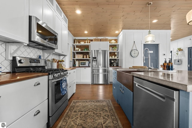 kitchen featuring wood ceiling, white cabinetry, open shelves, wood counters, and appliances with stainless steel finishes