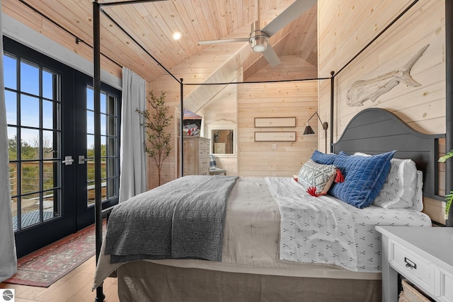 bedroom featuring lofted ceiling, wood finished floors, access to outside, wood ceiling, and wooden walls