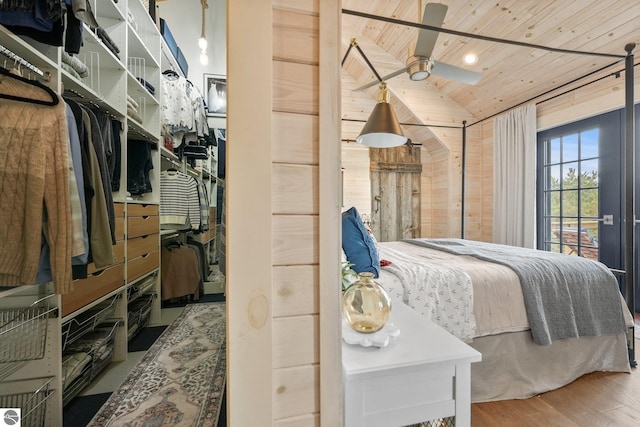 bedroom featuring wood ceiling, vaulted ceiling, and wood finished floors