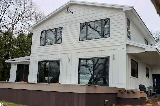 745 S Crescent Ave, Au Gres, MI 48703 - rear view of property featuring board and batten siding