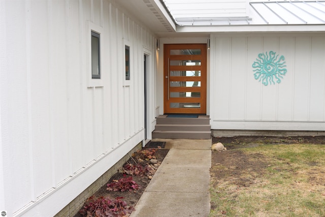 745 S Crescent Ave, Au Gres, MI 48703 - view of exterior entry featuring board and batten siding and metal roof