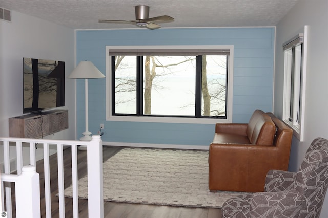 745 S Crescent Ave, Au Gres, MI 48703 - interior space featuring visible vents, a textured ceiling, and wood finished floors
