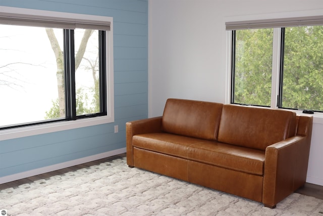 745 S Crescent Ave, Au Gres, MI 48703 - living area featuring plenty of natural light, baseboards, and wood finished floors