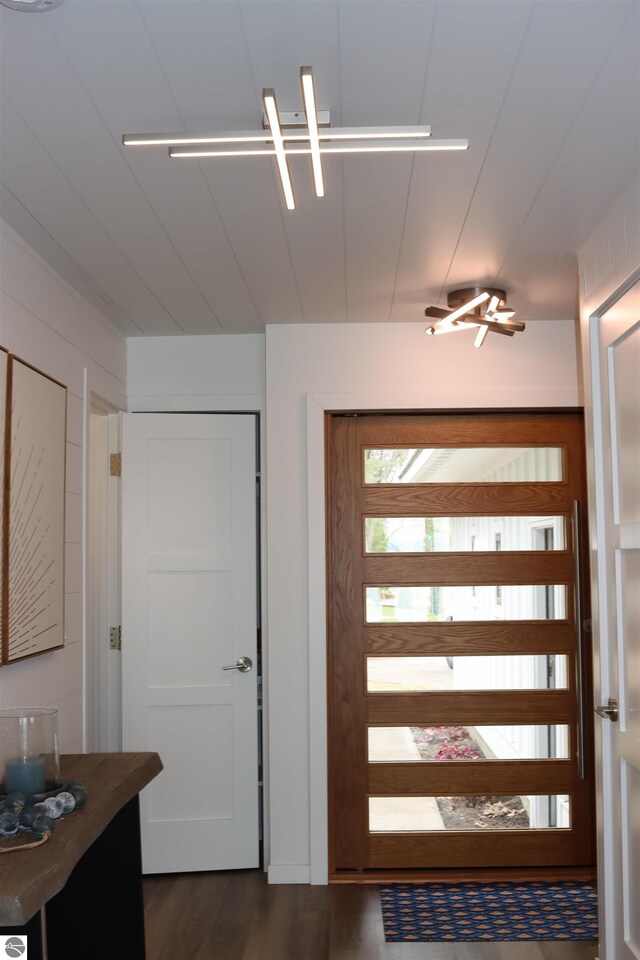 745 S Crescent Ave, Au Gres, MI 48703 - doorway to outside with dark wood-type flooring
