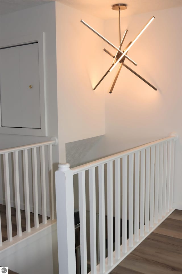 745 S Crescent Ave, Au Gres, MI 48703 - staircase featuring an inviting chandelier and wood finished floors
