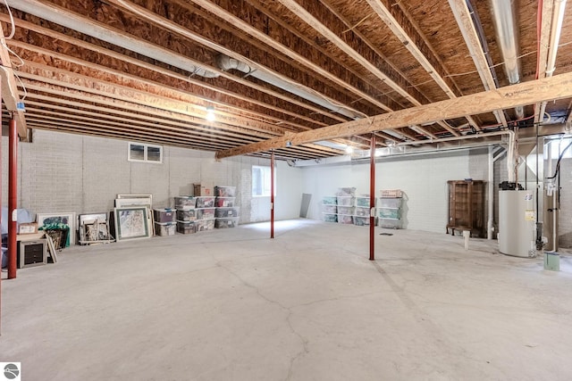 below grade area featuring water heater