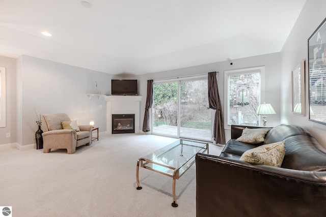 carpeted living area featuring a fireplace