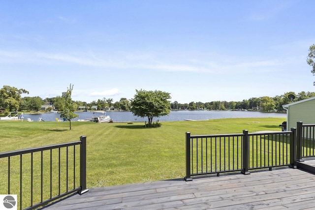 wooden deck featuring a yard and a water view
