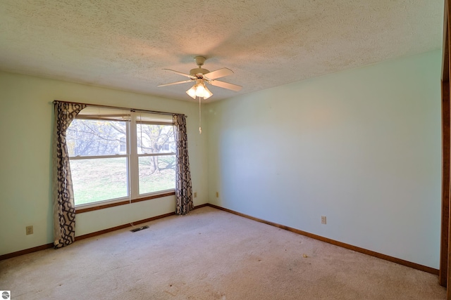 1173 Sunview, Saint Johns, MI 48879 - empty room featuring a textured ceiling, baseboards, visible vents, light colored carpet, and a ceiling fan
