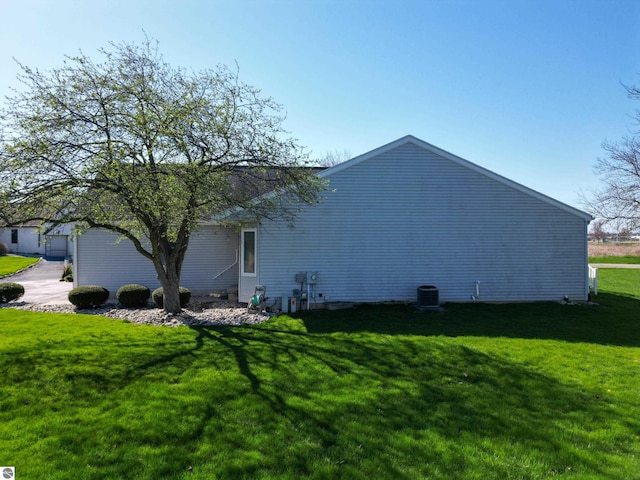1173 Sunview, Saint Johns, MI 48879 - view of side of property with cooling unit and a yard
