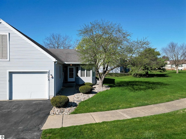 1173 Sunview, Saint Johns, MI 48879 - ranch-style home featuring an attached garage, driveway, a front lawn, and roof with shingles