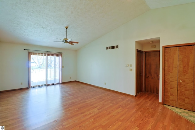 1173 Sunview, Saint Johns, MI 48879 - empty room featuring lofted ceiling, a ceiling fan, visible vents, and light wood-style flooring