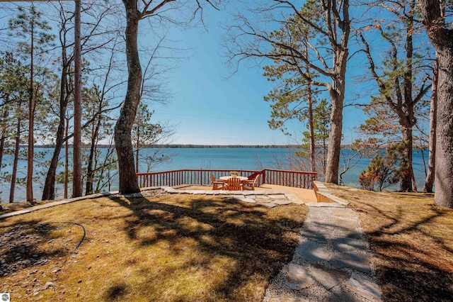 wooden deck featuring a water view