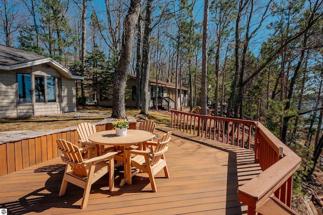deck with outdoor dining area