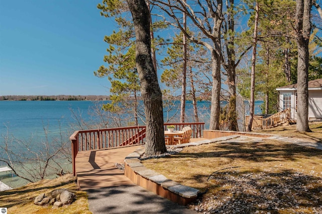 view of yard featuring a deck with water view