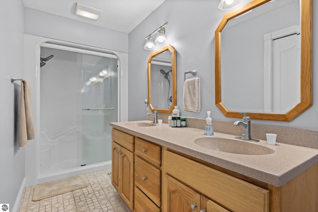 full bathroom with a sink, double vanity, and a shower
