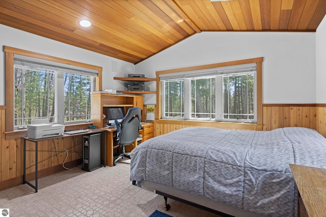 bedroom featuring wainscoting, wooden walls, multiple windows, and wooden ceiling