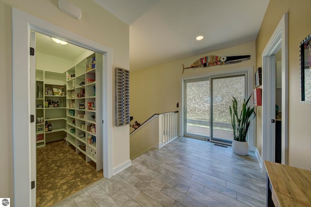 foyer entrance featuring baseboards and recessed lighting