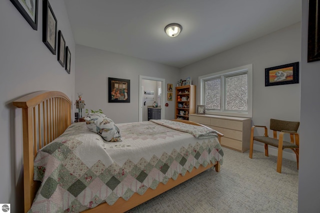 bedroom featuring light carpet