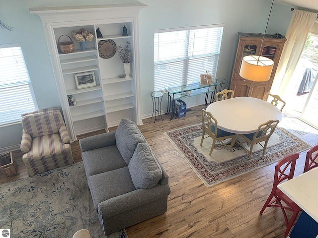 2708 Ruby St, Traverse City, MI 49684 - living area with wood finished floors, baseboards, and built in shelves