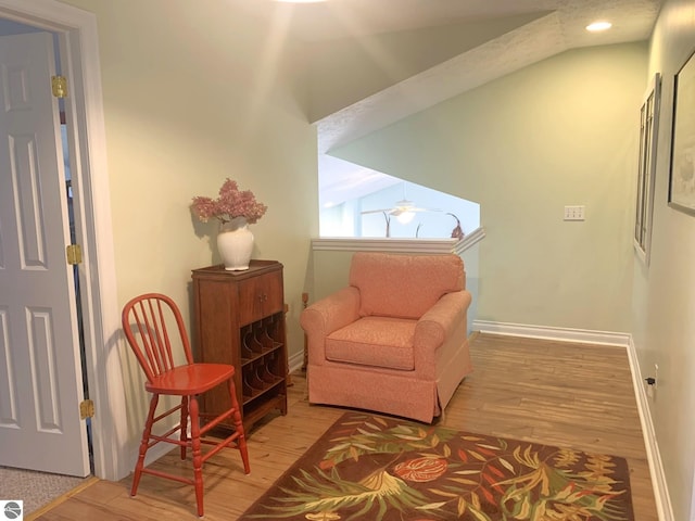 2708 Ruby St, Traverse City, MI 49684 - sitting room featuring wood finished floors, recessed lighting, baseboards, and lofted ceiling