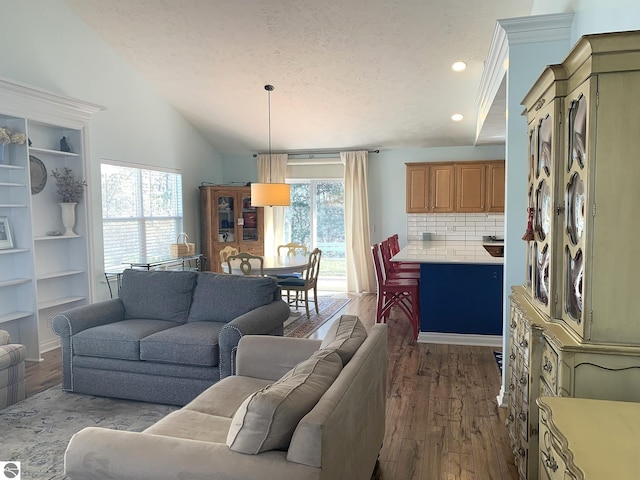 2708 Ruby St, Traverse City, MI 49684 - living room with dark wood finished floors, vaulted ceiling, recessed lighting, and a textured ceiling