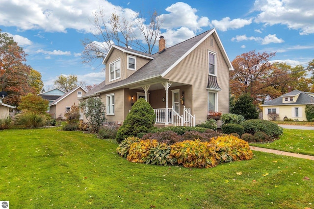 view of home's exterior featuring a porch, a lawn, and a chimney