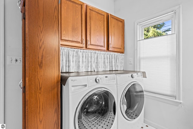 laundry room with washer and dryer and cabinet space