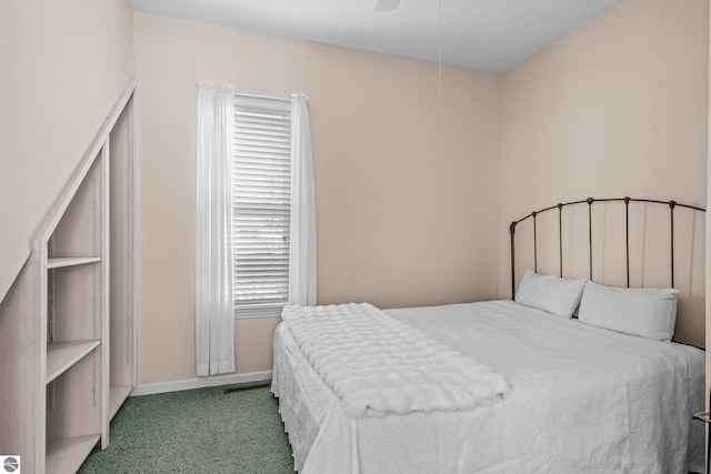 bedroom featuring baseboards, carpet floors, and ceiling fan