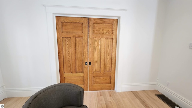 interior space featuring wood finished floors and visible vents
