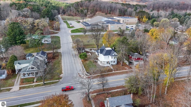 aerial view with a wooded view and a residential view