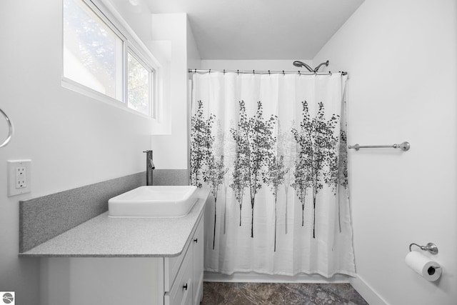 419 S Cherry St, Kalkaska, MI 49646 - full bath featuring vanity and a shower with shower curtain