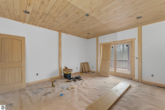 2609 Big Sky Rd, Kingsley, MI 49649 - spare room featuring wood ceiling, baseboards, french doors, and concrete floors