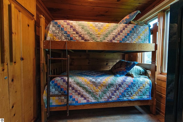 bedroom featuring wood finished floors and wooden ceiling