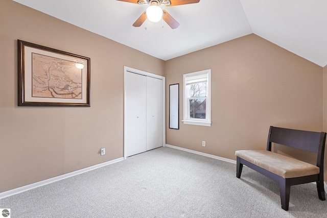 unfurnished room with baseboards, carpet flooring, a ceiling fan, and lofted ceiling