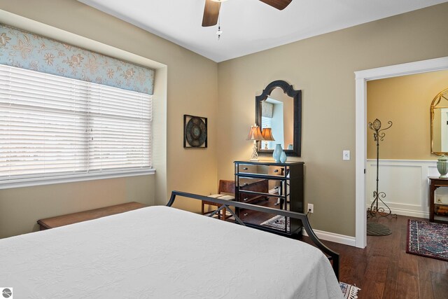 4584 Kodiak Dr, Traverse City, MI 49685 - bedroom with ceiling fan, baseboards, and wood finished floors