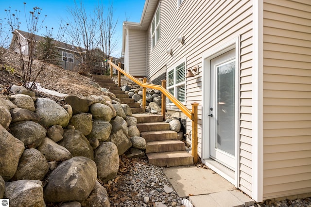 4584 Kodiak Dr, Traverse City, MI 49685 - view of side of home featuring stairs