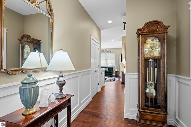 4584 Kodiak Dr, Traverse City, MI 49685 - hall featuring wainscoting, a decorative wall, dark wood-type flooring, and recessed lighting
