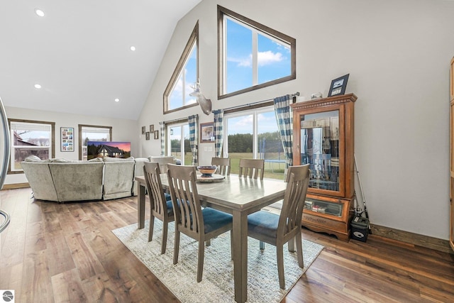 5891 Voice Rd, Kingsley, MI 49649 - dining room with light wood-style flooring and high vaulted ceiling