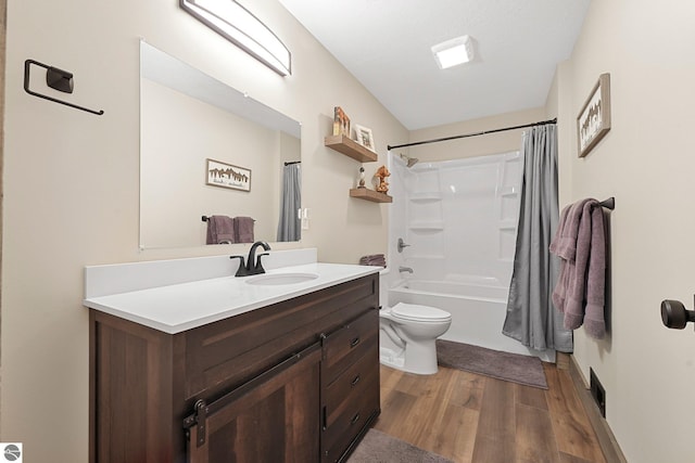 5891 Voice Rd, Kingsley, MI 49649 - full bathroom with wood finished floors, vanity, shower / bath combo with shower curtain, toilet, and visible vents